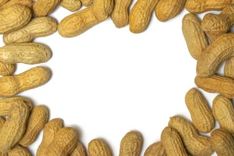 Pile of roasted peanuts on a white background Stock Photos