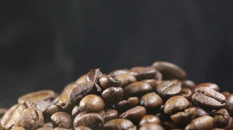 A pile of roasting coffee beans on black background isolated Stock Footage 56708748