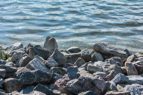 Pile of rocks on lakeside Stock Photos