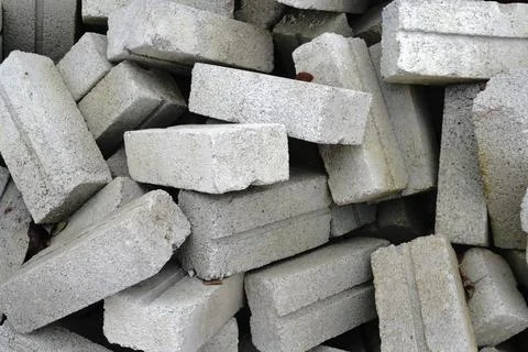 A pile of rough rectangular gray concrete blocks 写真素材