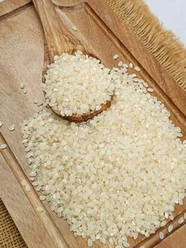 Pile of round rice, close-up, on a table Stock Photos