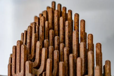 A pile of rusty metal sticks with a triangular shape 스톡 사진
