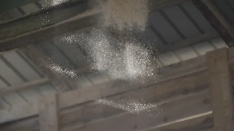 Pile of sawdust falling down with particles in the air Video stock 92318040