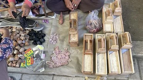 A pile of sharp tools such as knives, machetes, axes, sickles, metal sickles Stock Photos