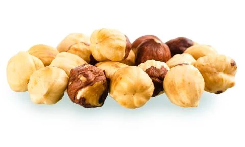 A pile of shell-less hazelnuts, isolated on white background Foto stock