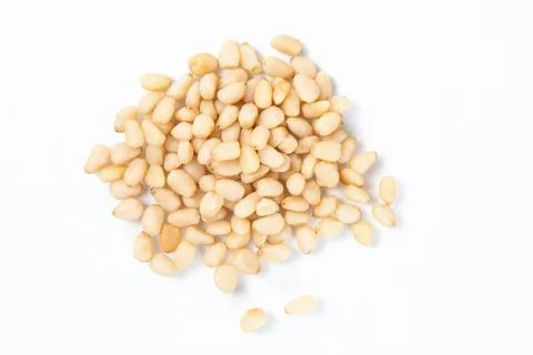 Pile Of Shelled Pine Nuts On A White Background Stock Photos
