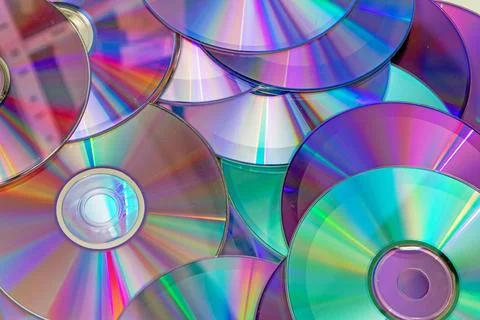 Pile of shiny compact discs pattern background Stock Photos