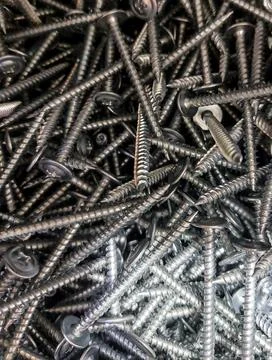 Pile of Silver Metal Self-Tapping Screws Background Stock Photos