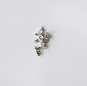 Pile of silver wire clips on white background with copy space Stock Photos