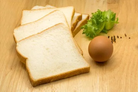 Pile of sliced bread, egg and vegetable Pile of sliced bread, egg and vege... 스톡 사진