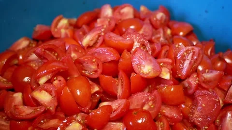 Pile Of Sliced Red Cherry Tomatoes In Blue Bowl During Food Preparation 库存影片 330119336