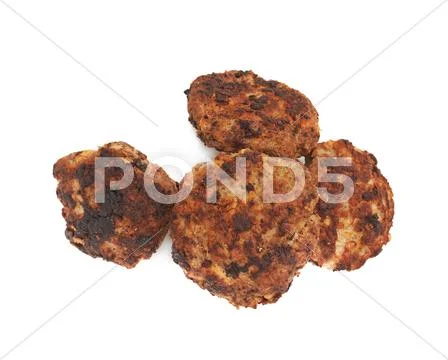 Pile of small hand made cutlets isolated over white background Stock Photos