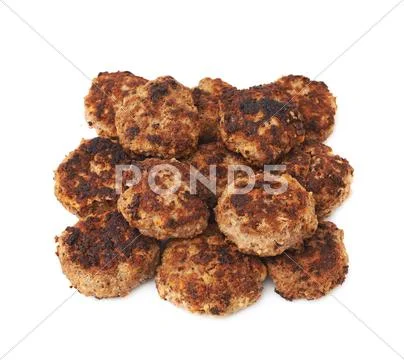 Pile of small hand made cutlets isolated over white background Stock Photos