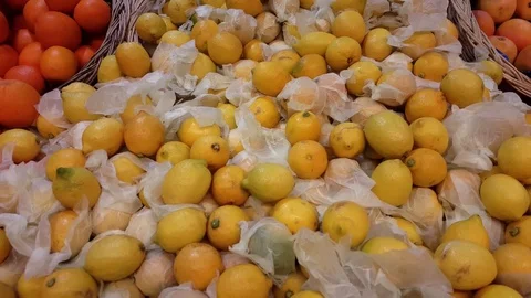 Pile of soft yellow lemons, pan motion Stock Footage 78767623