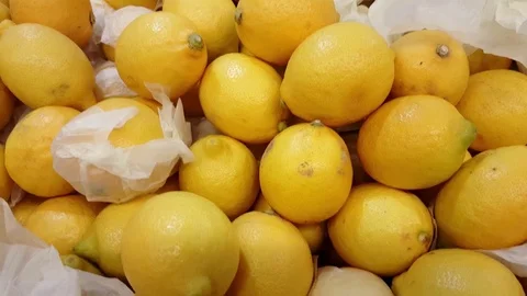 Pile of soft yellow lemons, pan motion Stock Footage 78767827