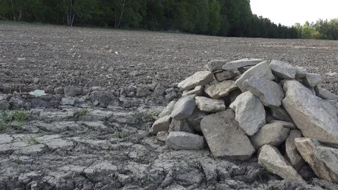 Pile of stones in the field Stock Footage 89207335