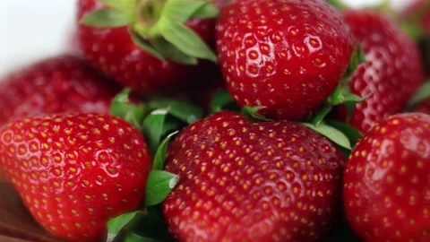 Pile of strawberries on a white background, close up, complete spin, loop 스톡 동영상 204741234