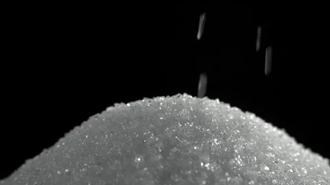 Pile of sugar on black background shooting with high speed camera close up Stock Footage 83035653