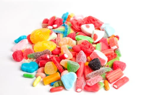 A pile of sweets on white background. Stock Photos