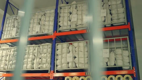 Pile of tent clothes are kept in storage in a factory in Sailkot, Pakistan Video stock 332567065