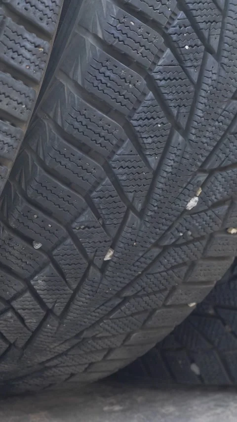 Pile of tires pressed tightly highlights winter pattern strength Stock Footage 323260104