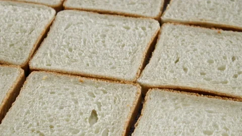 Pile of toast bread ordered on the table. Close up Stock Footage 137647026