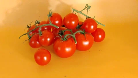 A pile of tomatoes on a yellow background Video stock 334001635