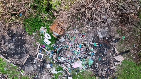 A pile of trash is on the ground Видео 317260069