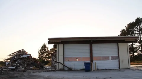 Pile of trash sits next to garage Stock Footage 95112656