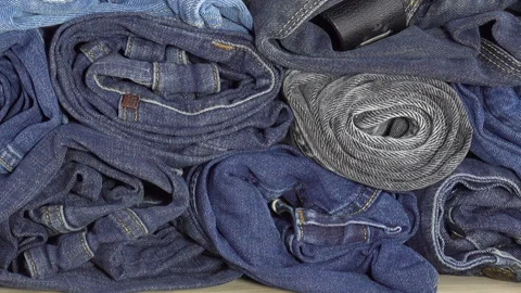 A pile of twisted denim Stock Footage 154159382