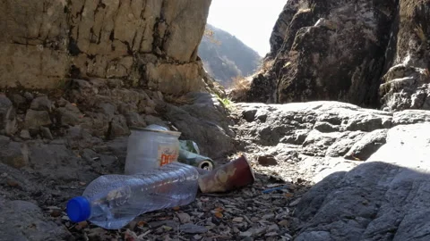 A pile of used packaging abandoned in the mountains. Stock-Footage 164866446