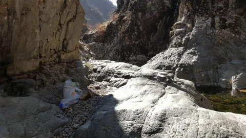A pile of used packaging left by hikers in the mountains. Stock-Footage 164866381