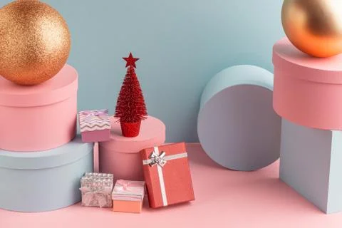 Pile of various gift boxes, balls and Christmas tree on turquoise background Stock Photos