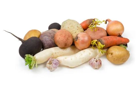 Pile of various uncooked root vegetables on a white background Stock Photos