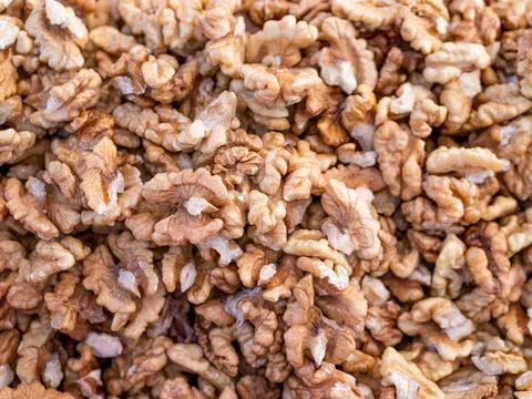 Pile of walnut kernels. Background texture from walnut kernels Stock-Fotos