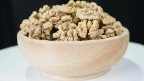 Pile walnut without shell, rotates, close up. Video stock 267517550