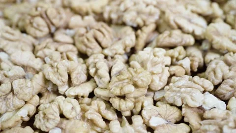 Pile walnut without shell, rotates, close up. Video stock 268597437