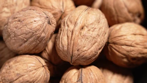 Pile of walnuts close up. Whole nuts in natural shell. Stock Footage 330420779