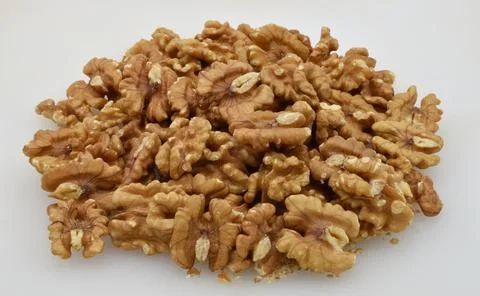 Pile of walnuts isolated on white background. Stock Photos