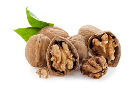Pile of walnuts with leaves Stock Photos