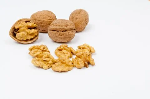 Pile of walnuts on white background Stock Photos