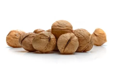 A pile of walnuts on a white background Stock Photos