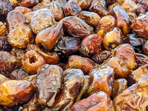 Pile of wet dates macro background close up stock photo 写真素材