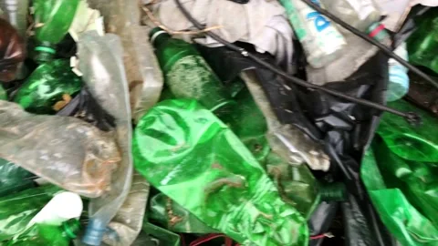 Pile of white and green plastic bottles Stock Footage 203293161