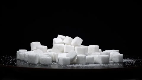 Pile of White Sugar Cubes on a Black Background Stock Footage 263229212