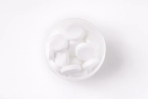 Pile of white tablets Stock Photos