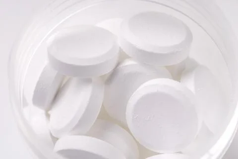 Pile of white tablets Stock Photos