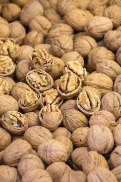 Pile of whole walnuts  with hard nutshells Stock Photos