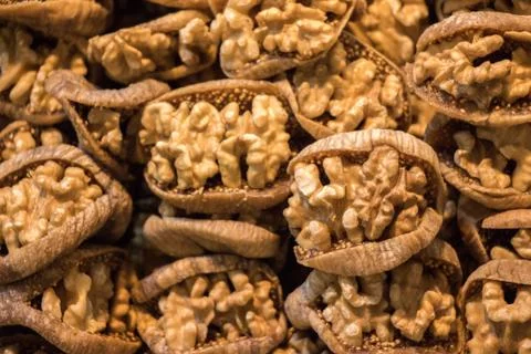 Pile of whole walnuts  without nutshells in fig Stock Photos