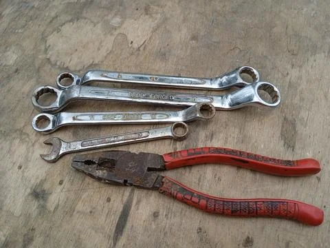 A pile of wrenches on the floor. Stock Photos